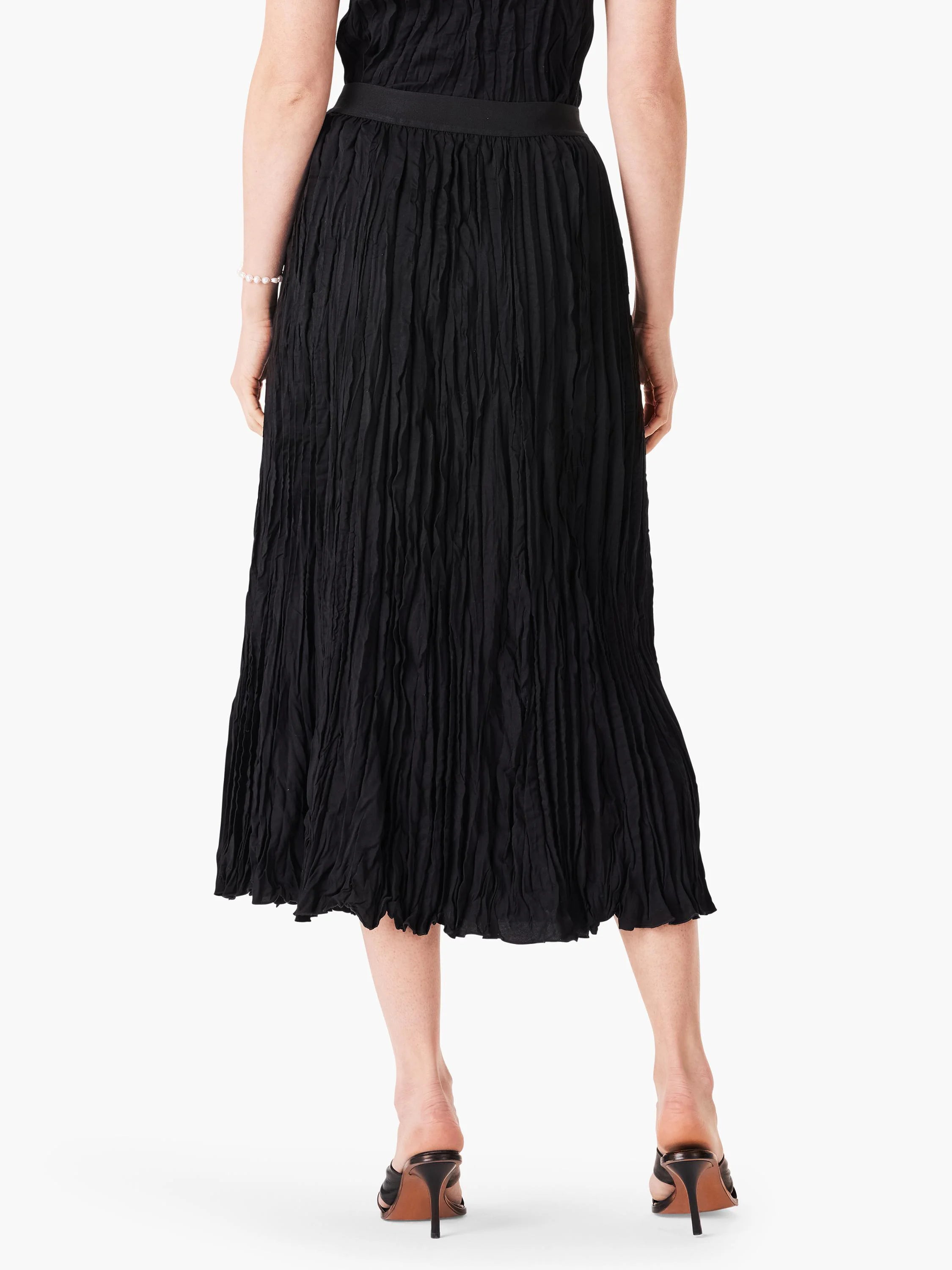 Black midi skirt with pronounced vertical crinkled texture and a smooth waistband.