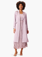 Pale mauve midi skirt with a prominent crinkled texture and vertical folds.