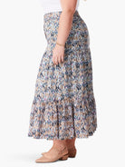 Here's alt text for the image, under 125 characters:

Tiered maxi skirt in blue, brown, and tan ikat pattern.  Multiple...