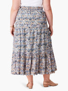 Tiered maxi skirt in blue, brown, and tan ikat print.  Elastic waistband.