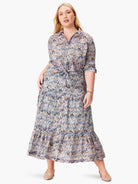 Maxi skirt with tiered ruffle hem. Ikat-style print in beige, blue, black, and pink.