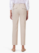 Beige straight-leg pants, back view.  Features two buttoned pockets.