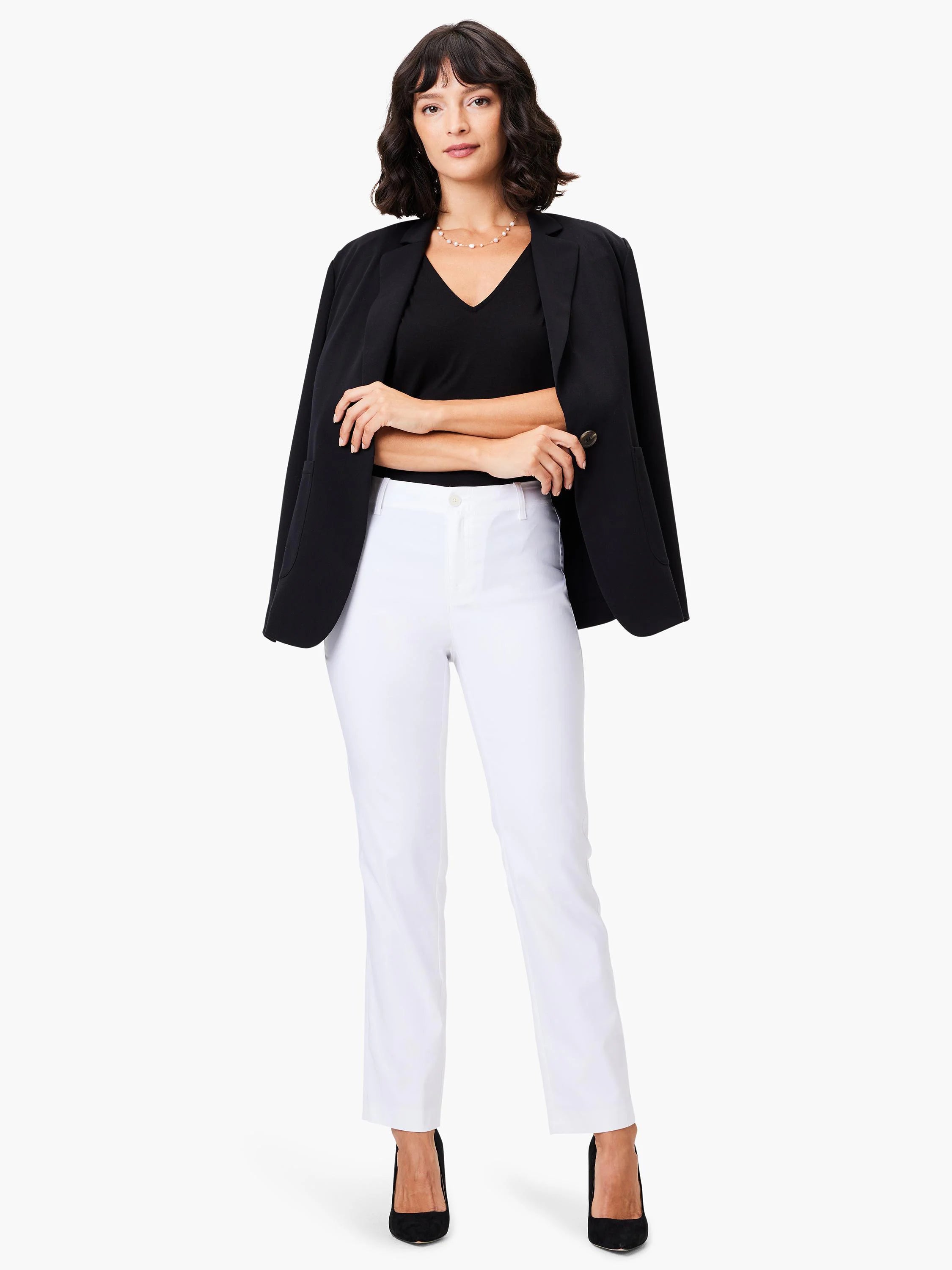 White straight-leg pants, shown on a model with a black blazer.