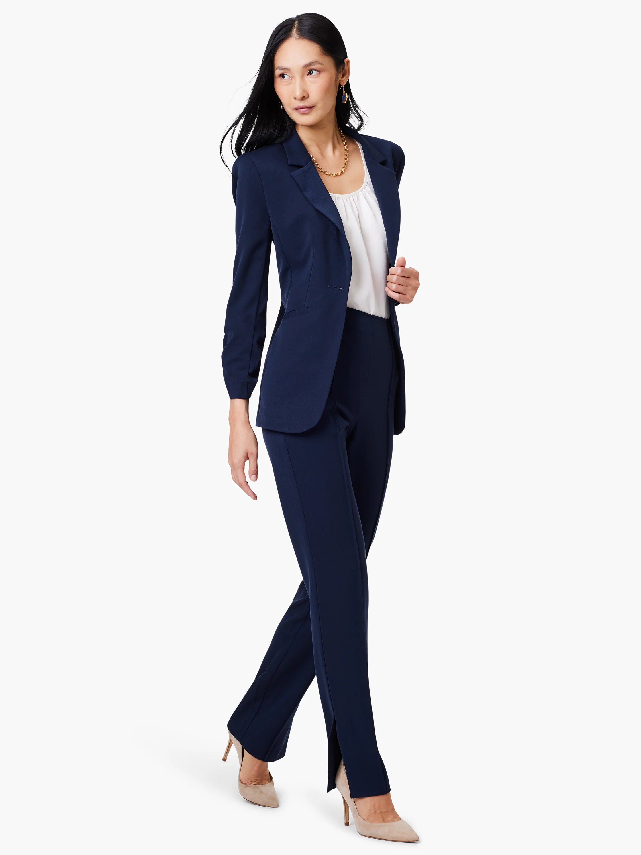 Navy blue straight-leg pants with side slits.  Model is wearing them with a navy blazer and light beige heels.