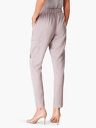 Light gray cargo pants with a relaxed fit, elastic waistband, and side pockets.  The pants are ankle-length.