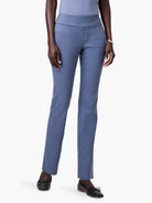 Model in dusty blue straight leg pants. Features a wide waistband and subtle stitch-defined front pockets.