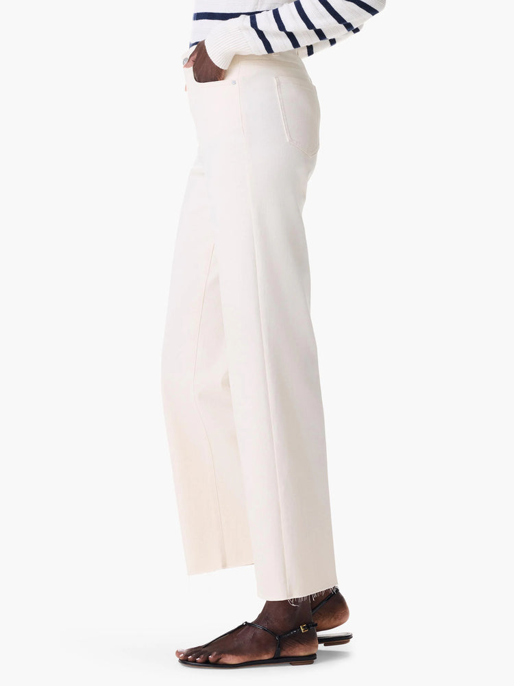 Cream wide-leg jeans with visible front/back pockets and raw hems, shown on a model.