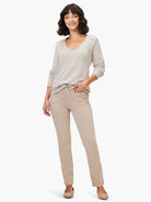 Khaki mid-rise straight jeans with distinctive front utility-style pockets.