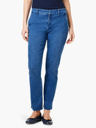 Medium blue straight ankle denim trousers with a concealed front fly, belt loops, and a frayed raw hem.
