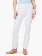 White straight-leg denim trousers with raw, frayed ankle hems.