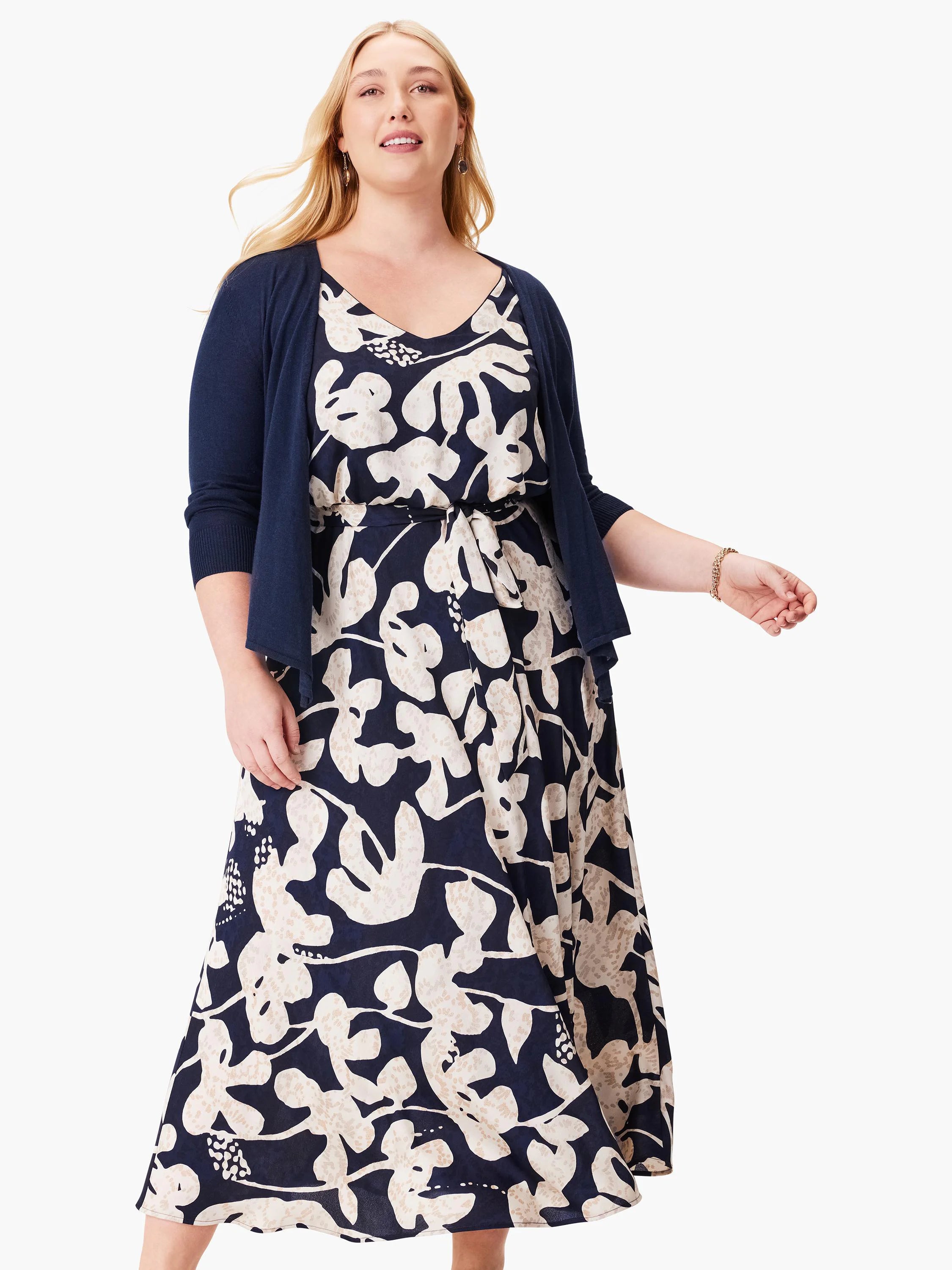 Navy midi dress with beige abstract floral print.  Features a V-neck and matching navy cardigan.