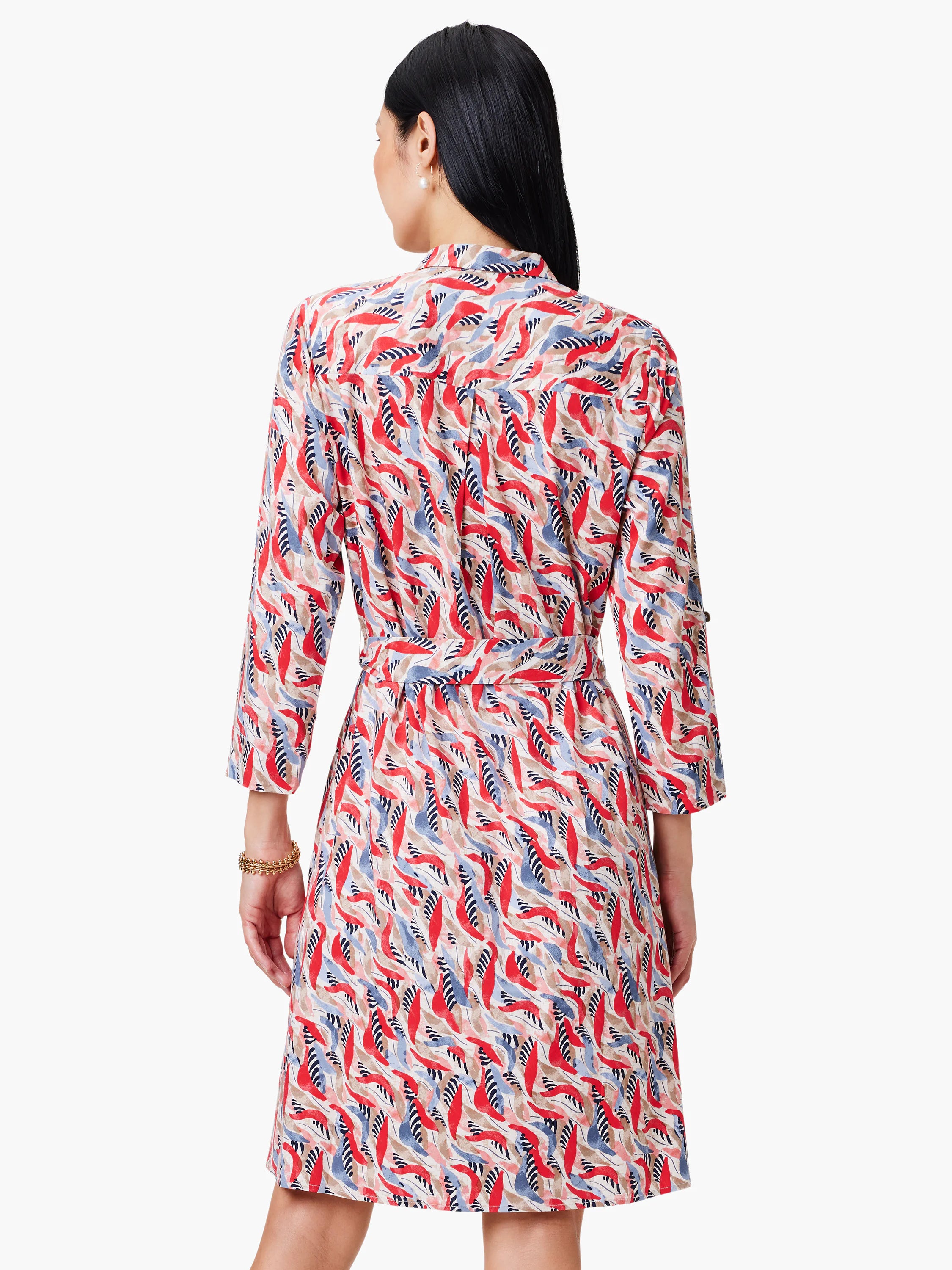Red, blue, and beige patterned shirt dress with a belted waist and three-quarter sleeves.
