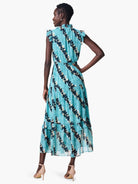 Teal midi dress with a ruffled neckline and tiered skirt. Features a dark-teal and beige leaf print. Sleeveless.
