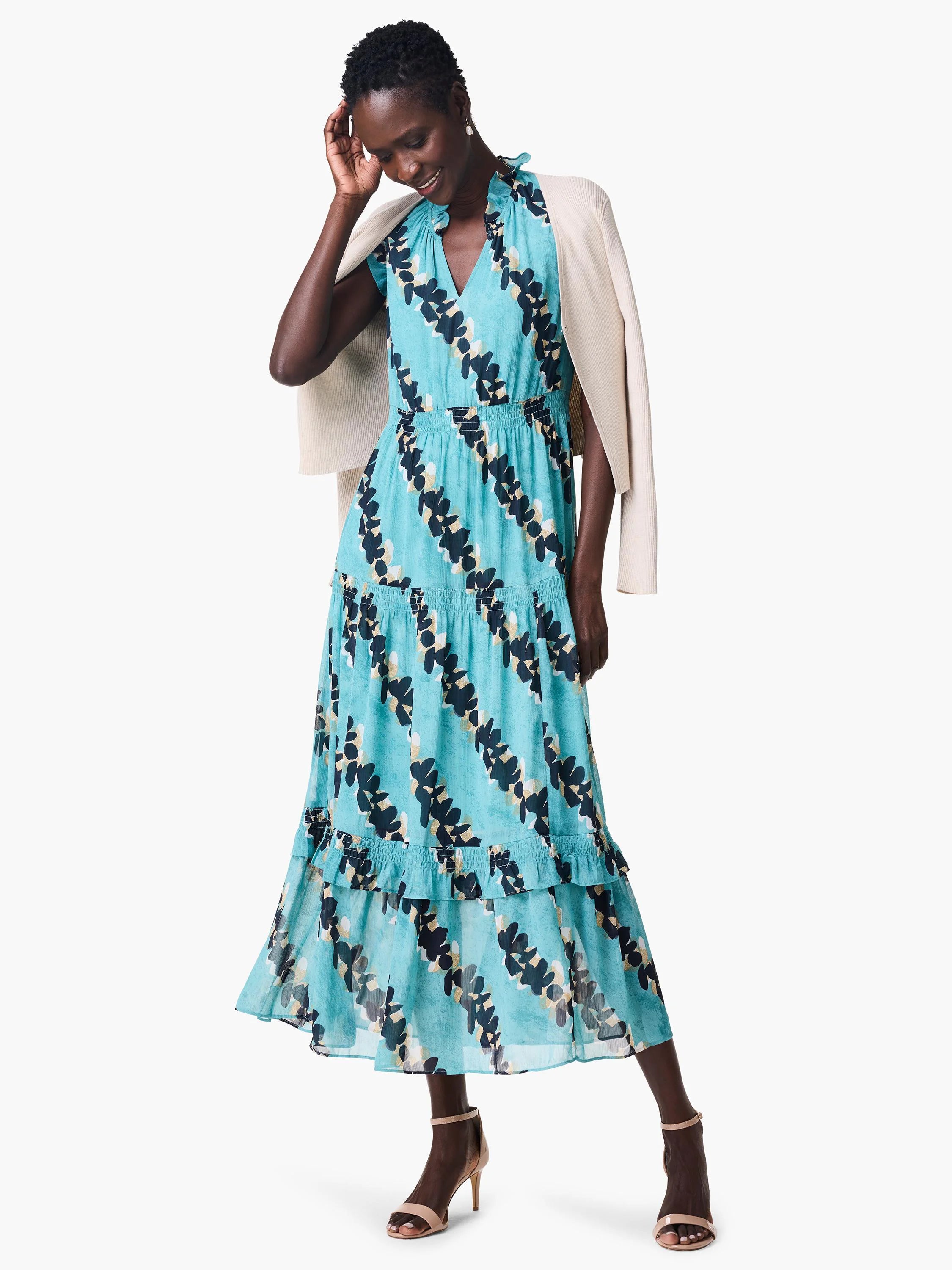 Teal midi dress with a V-neck, short sleeves, tiered skirt, and an abstract leaf print in black and beige.