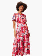 Midi dress, short sleeves, tiered skirt.  Pink, red, and white abstract floral print.  Elastic waist.