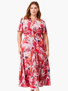 Midi dress, tiered skirt, short sleeves.  Pink, red, & muted orange abstract floral print on a cream background.  V-neck.