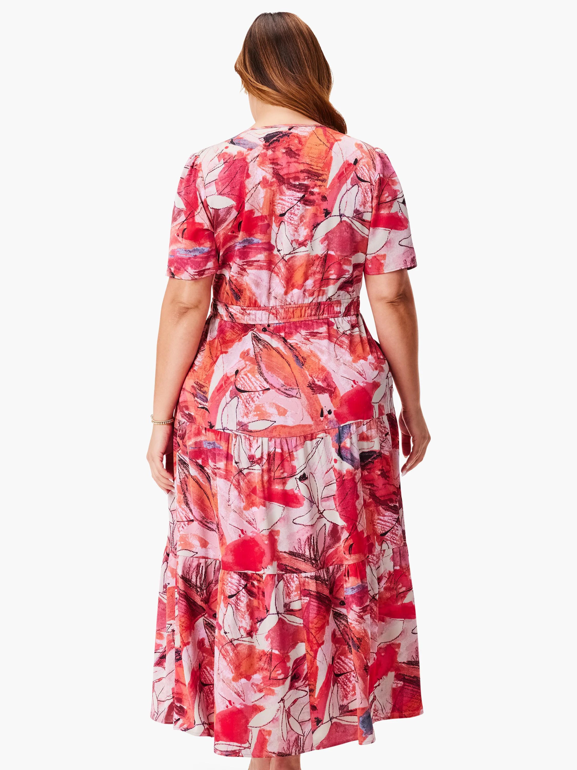 Red, pink, and cream abstract print maxi dress with short sleeves and tiered skirt.  Back view.