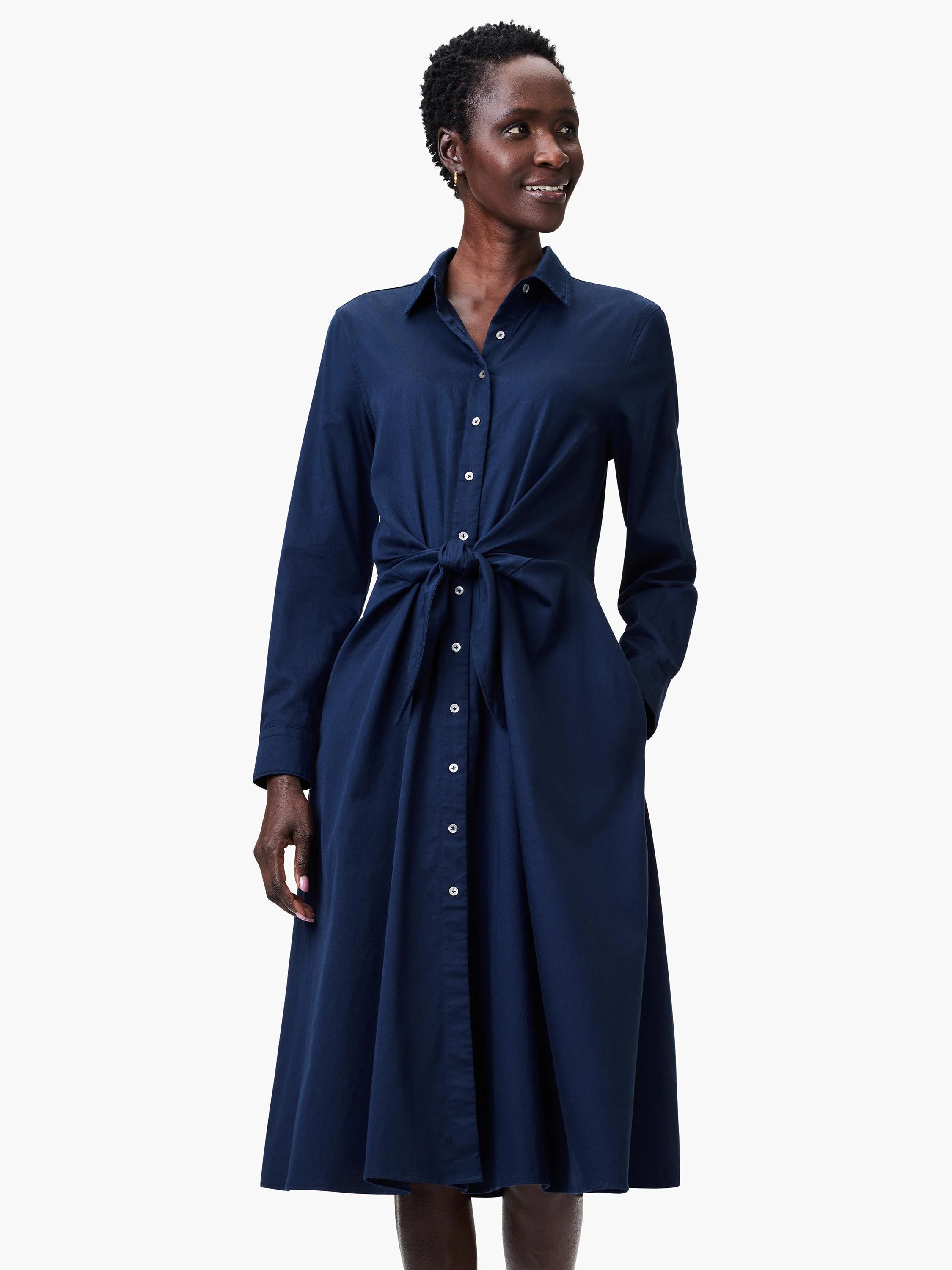Navy blue midi shirt dress with long sleeves, button front, and a self-tie belt at the waist.  Features pockets.