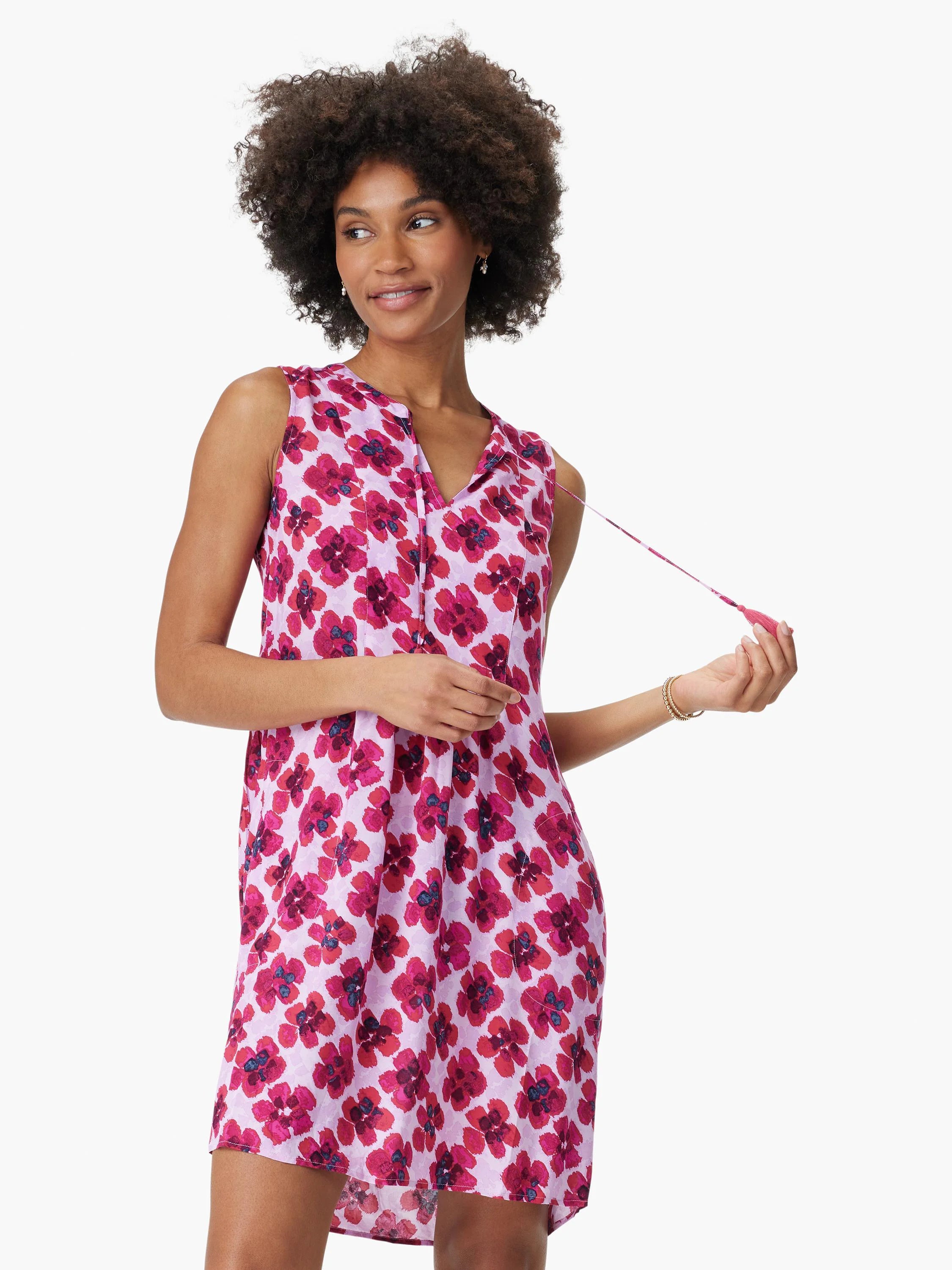 Pink sleeveless dress with a V-neck and a pink floral print.  The flowers are predominantly dark pink with touches of...