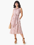 Sleeveless midi shirt dress with a belted waist.  Pink, brown, and white abstract animal print.