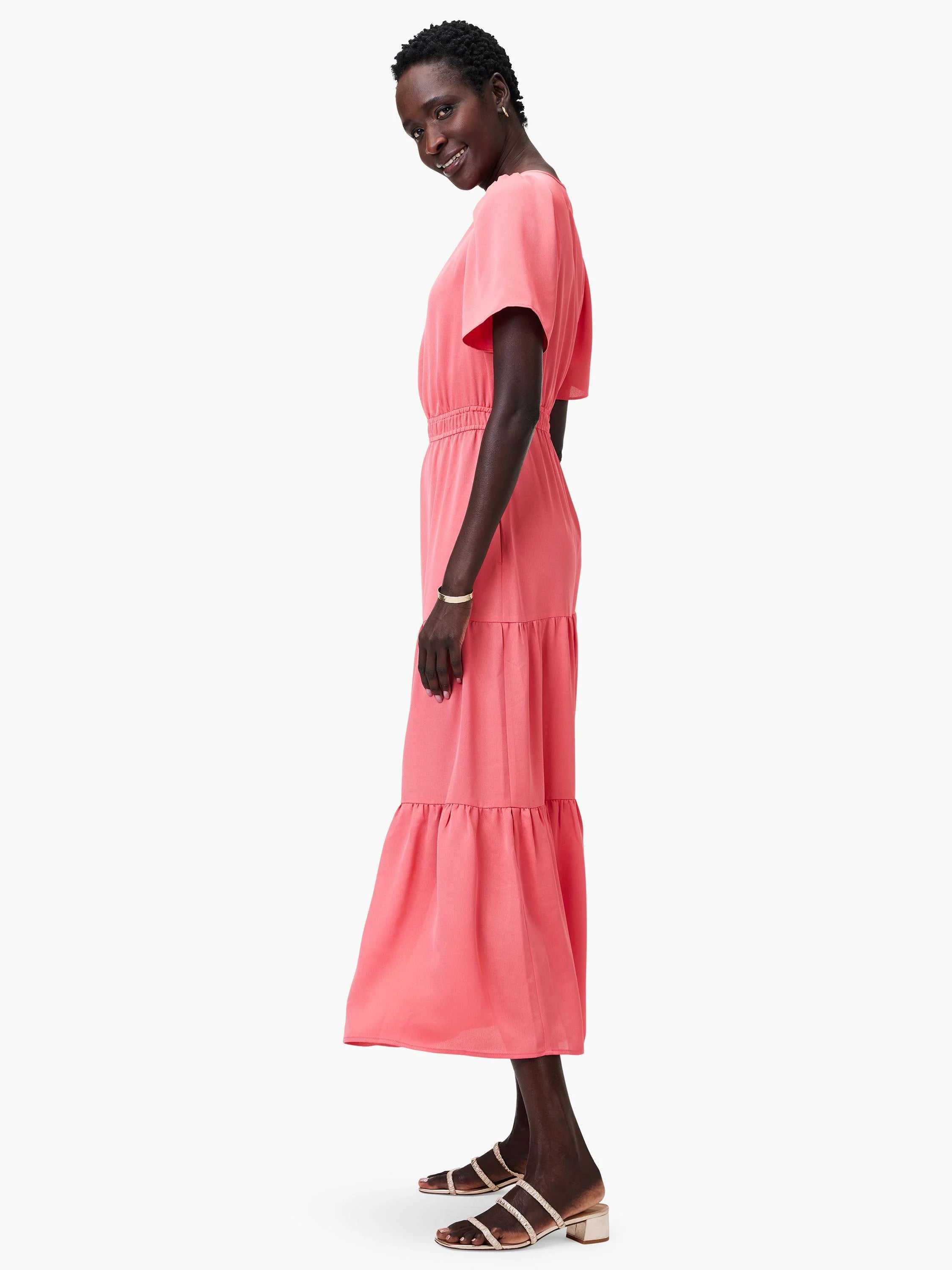 Coral pink midi dress with short flutter sleeves, cinched waist, and tiered skirt.