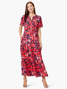 Maxi dress, red & pink floral print on navy blue background. Short sleeves, V-neck, tiered skirt, pockets.