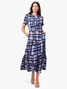 Midi dress, short sleeves, tiered skirt.  Navy, blue, and blush pink abstract print.  Pockets.