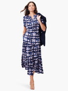 Midi dress, tiered skirt, short sleeves.  Navy, blue, and mauve abstract print.  V-neck.