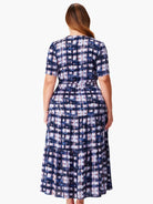 Here's alt text under 125 characters:

"Midi dress, dark blue, lavender, and beige abstract print. Short sleeves, tiered...