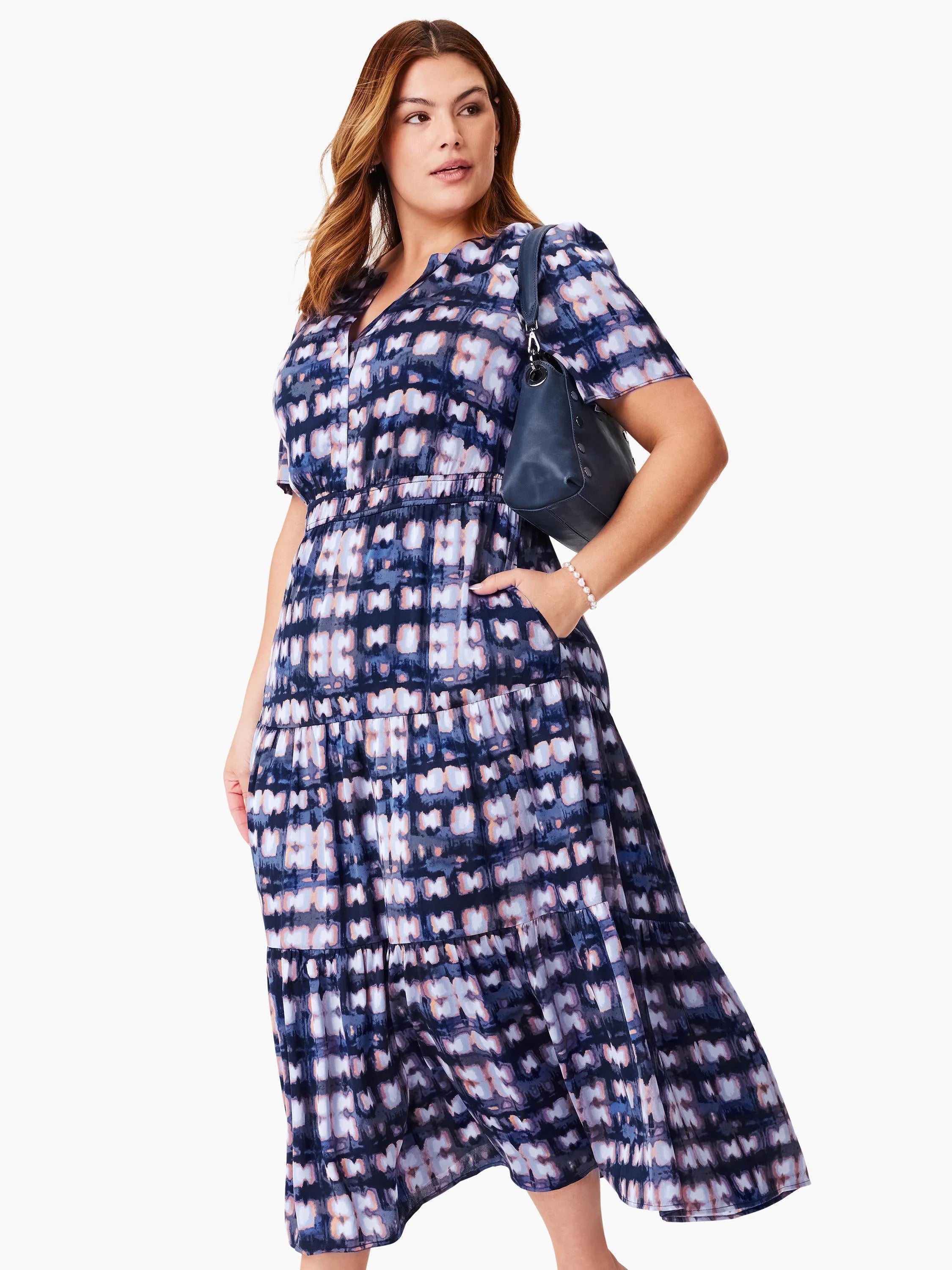 Midi dress, tiered skirt, short sleeves.  Dark blue, purple, and light peach print.  Loose fit.