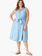 Light blue denim shirtdress, sleeveless, belted at waist, button front, knee-length.
