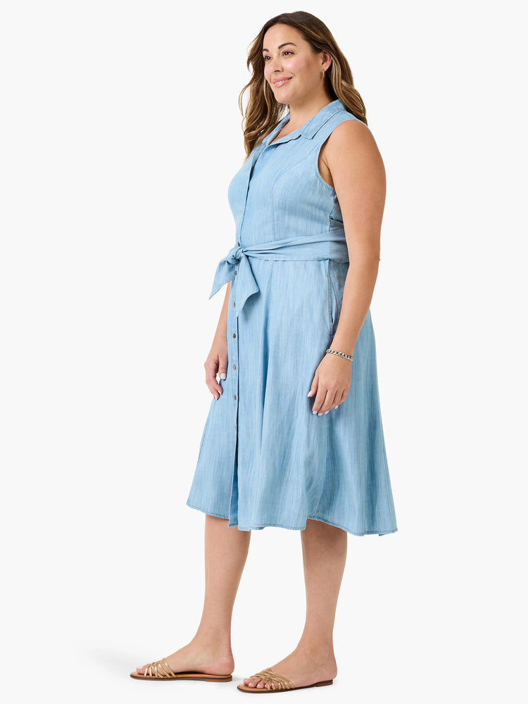 Light blue denim shirtdress, sleeveless, belted waist, knee-length, button front.