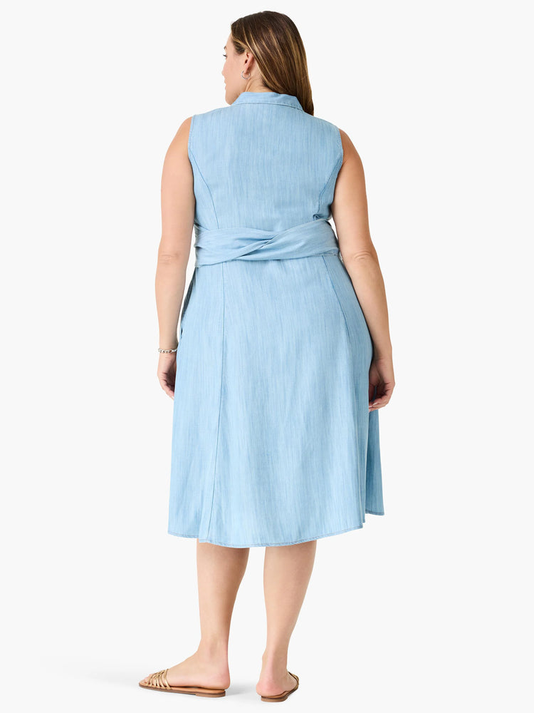 Here's alt text for the image, under 125 characters:

"Light blue denim shirtdress, sleeveless, knee-length, belted at...