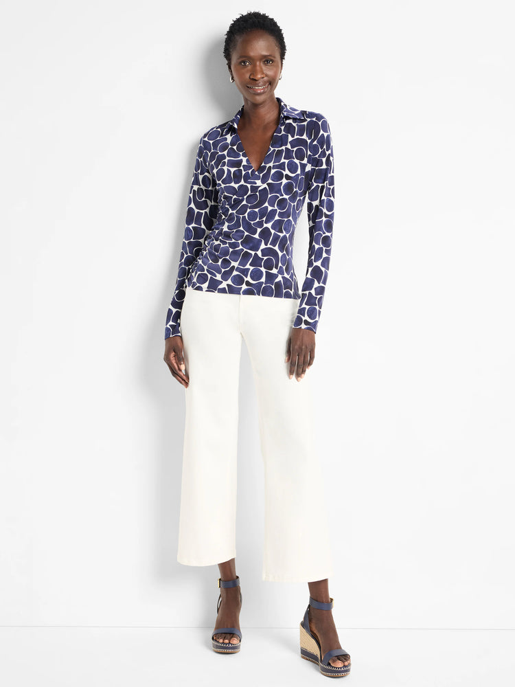 Navy and cream geo pebble print knit wrap top with V-neck and long sleeves.