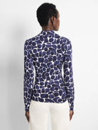 Back of a long-sleeved top with a navy blue and white irregular pebble pattern.