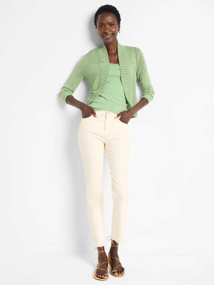 Model wears a light green ribbed scoop neck tank top.