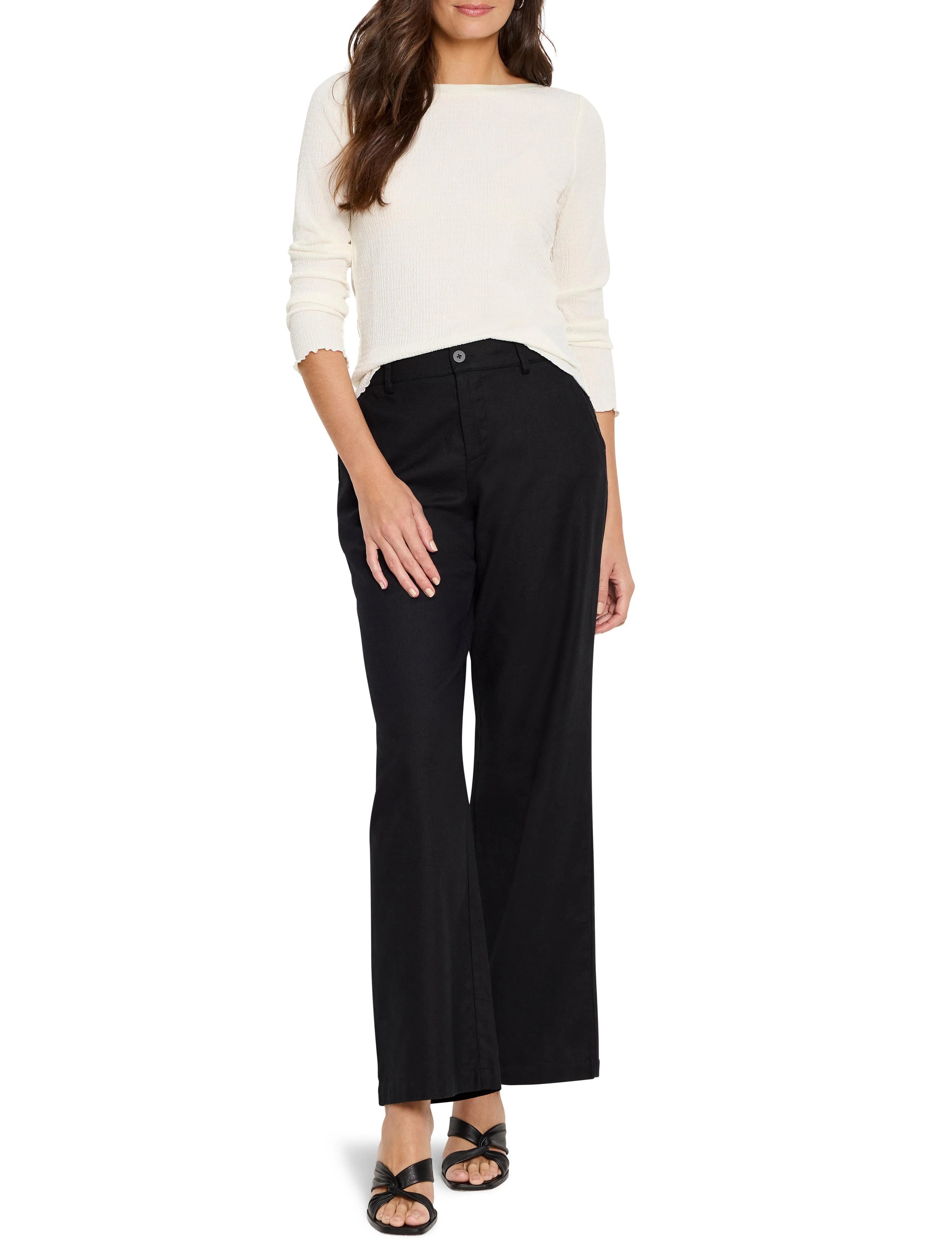 Cream bubble knit top with long sleeves, wide neck, and ruffled cuffs.