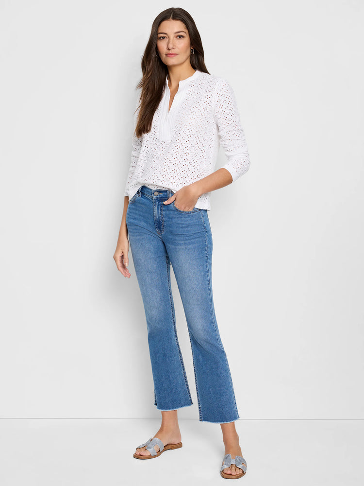 White knit eyelet top with a split neck and long sleeves.