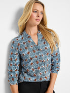 Blue, brown & white dotted sand dollar pattern top with V-neck and 3/4 rolled sleeves.
