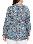 Long-sleeved knit top with brown diamond shapes and blue/white dotted circles resembling sand dollars.