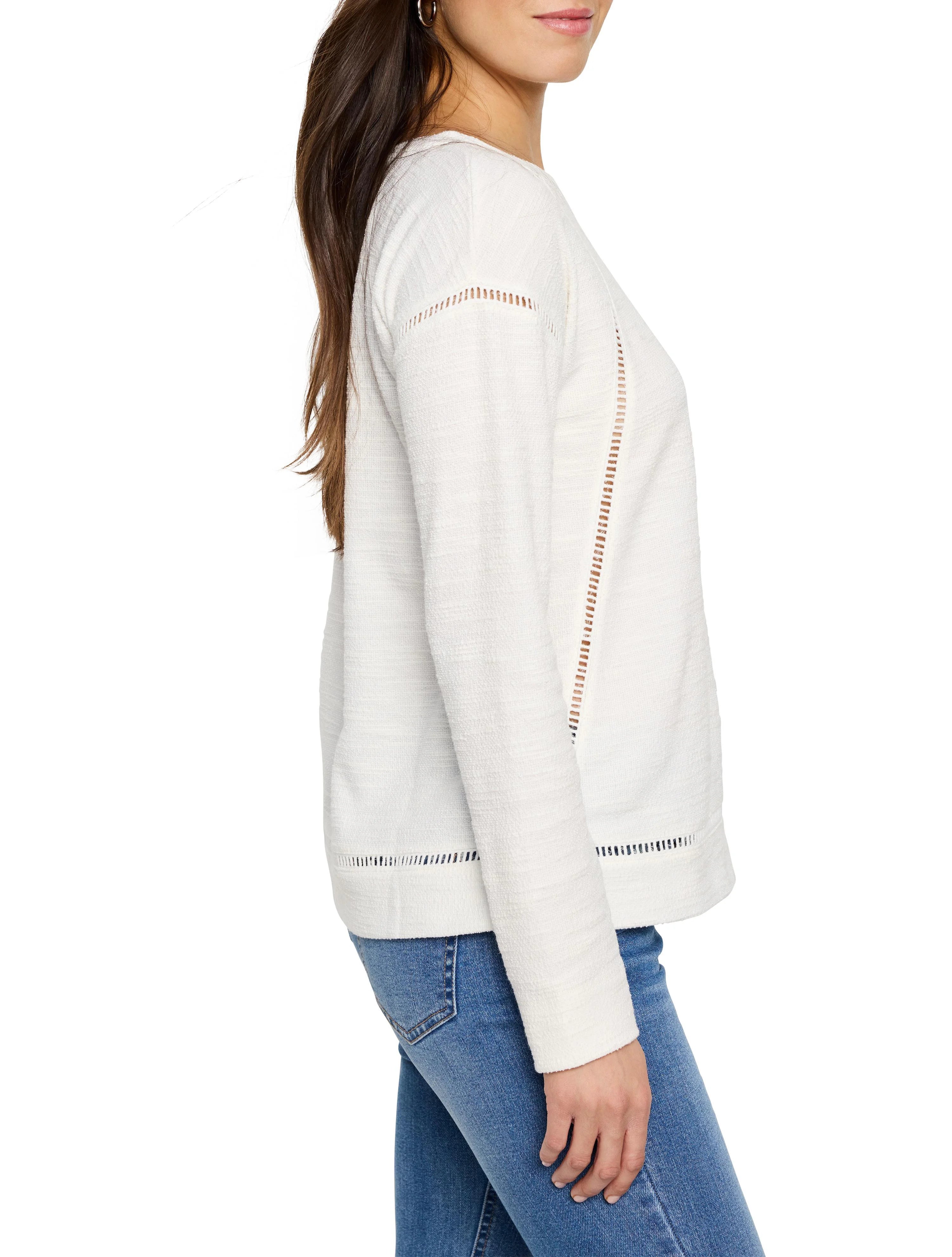 Off-white seamed texture long-sleeve top with vertical cut-out details on sides and hem.