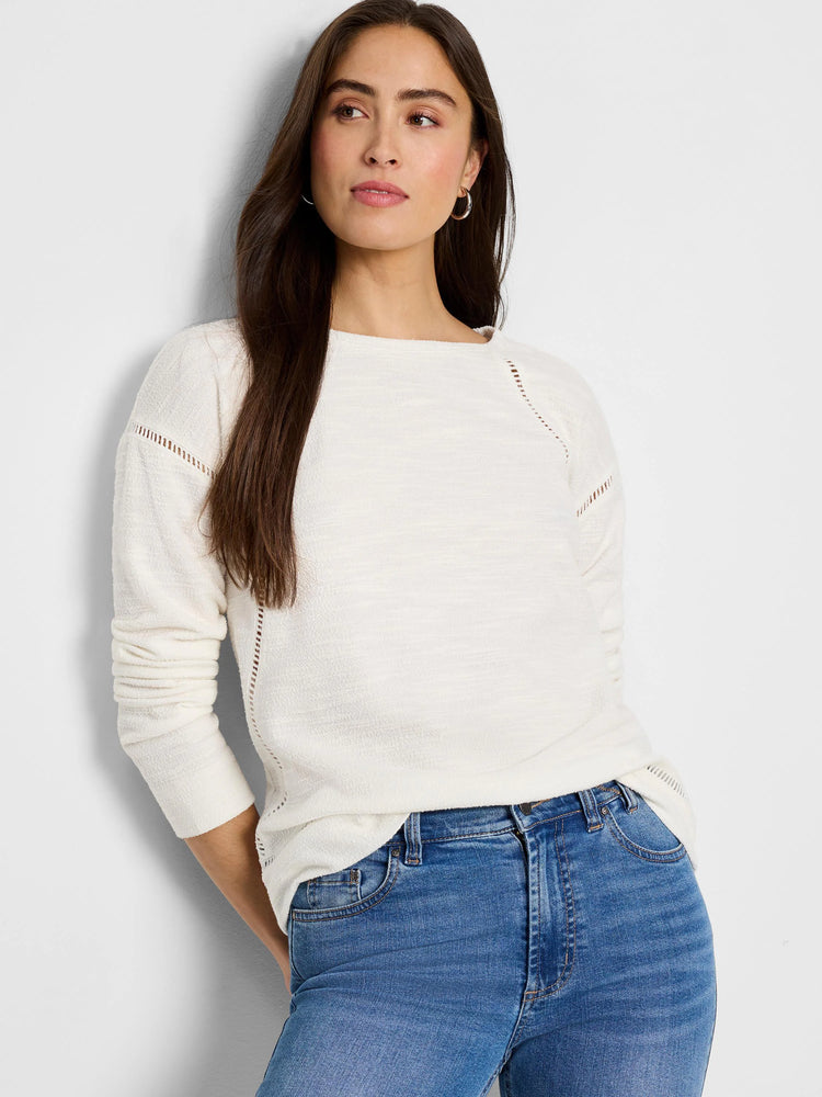 Cream textured long-sleeve top with open ladder-stitch details at shoulders & sides.