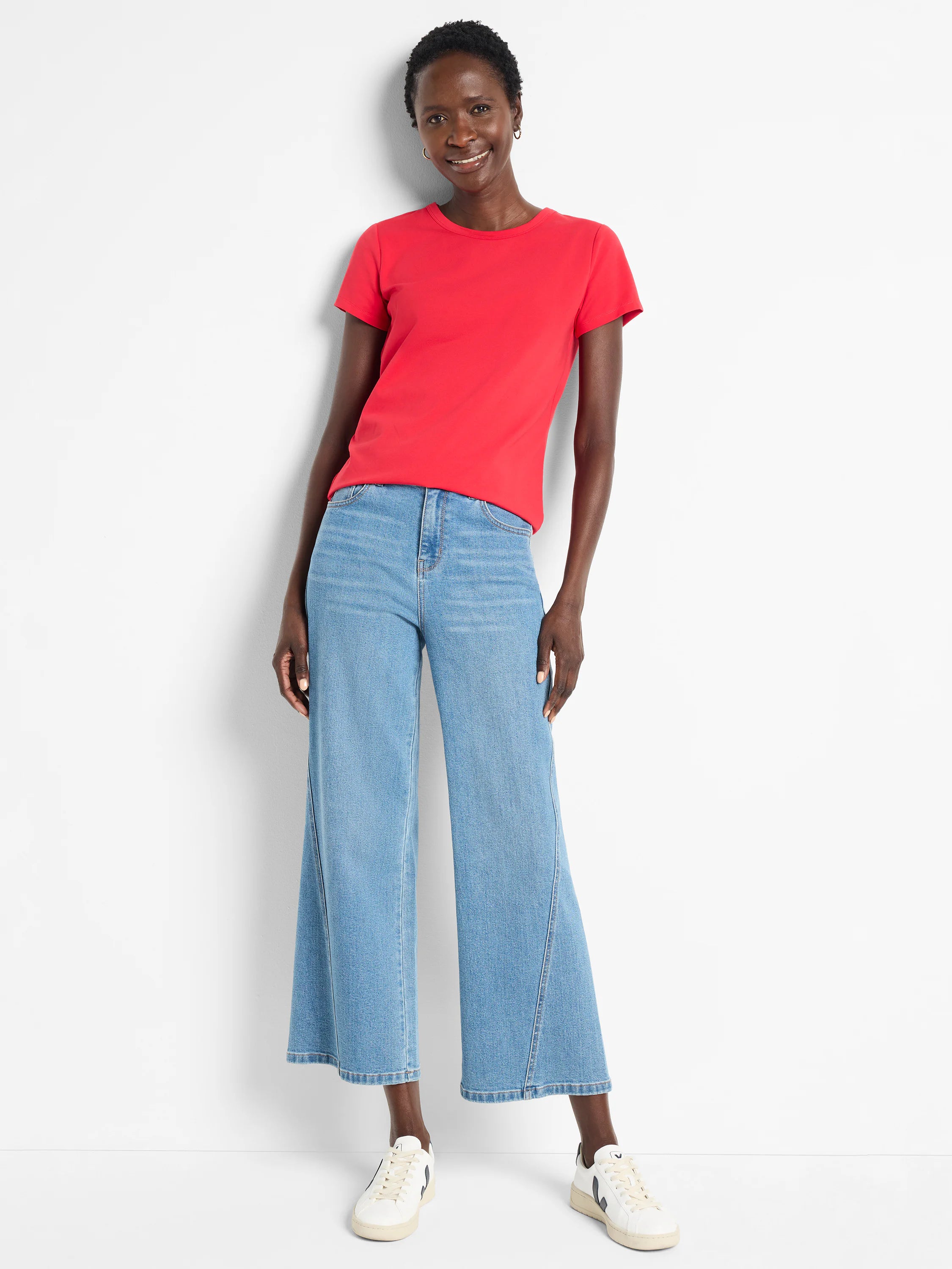 Solid red knit crew neck t-shirt with short sleeves, worn by a model.