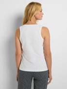 Sleeveless white knit tank top with a smooth texture and a rounded neckline, shown from the back.