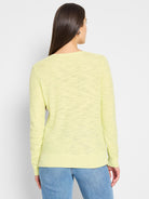 Pale yellow, long-sleeved sweater featuring a textured, lightweight knit with ribbed cuffs and hem.