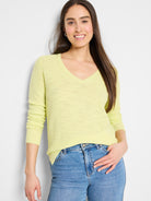 Lime green V-neck sweater with a breezy, textured knit. Features long sleeves and ribbed cuffs.
