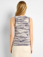 Sleeveless knit tank in cream and indigo with horizontal wavy patterns. Back view.