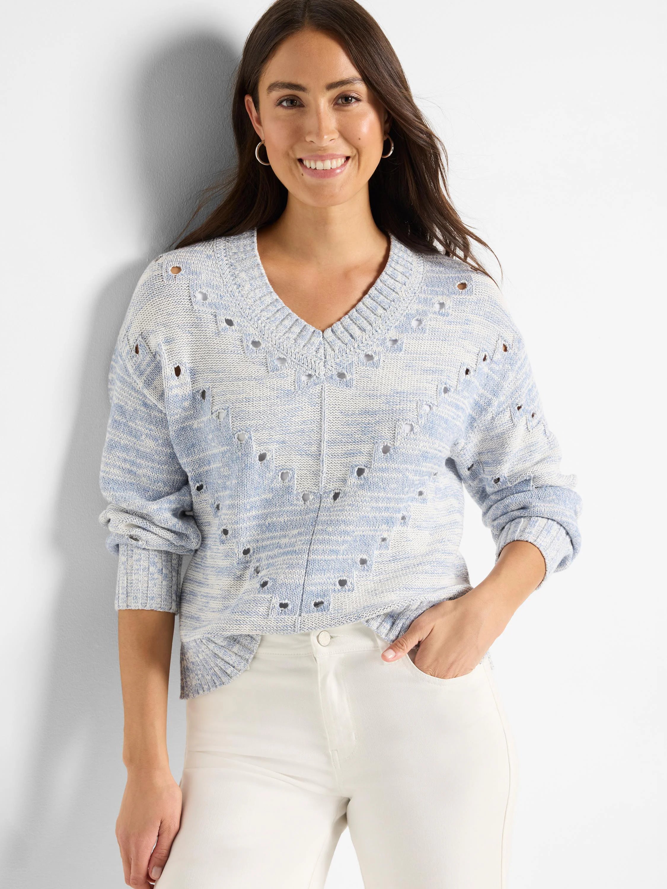 Light blue and white marled V-neck sweater featuring pointelle knit with small holes throughout.