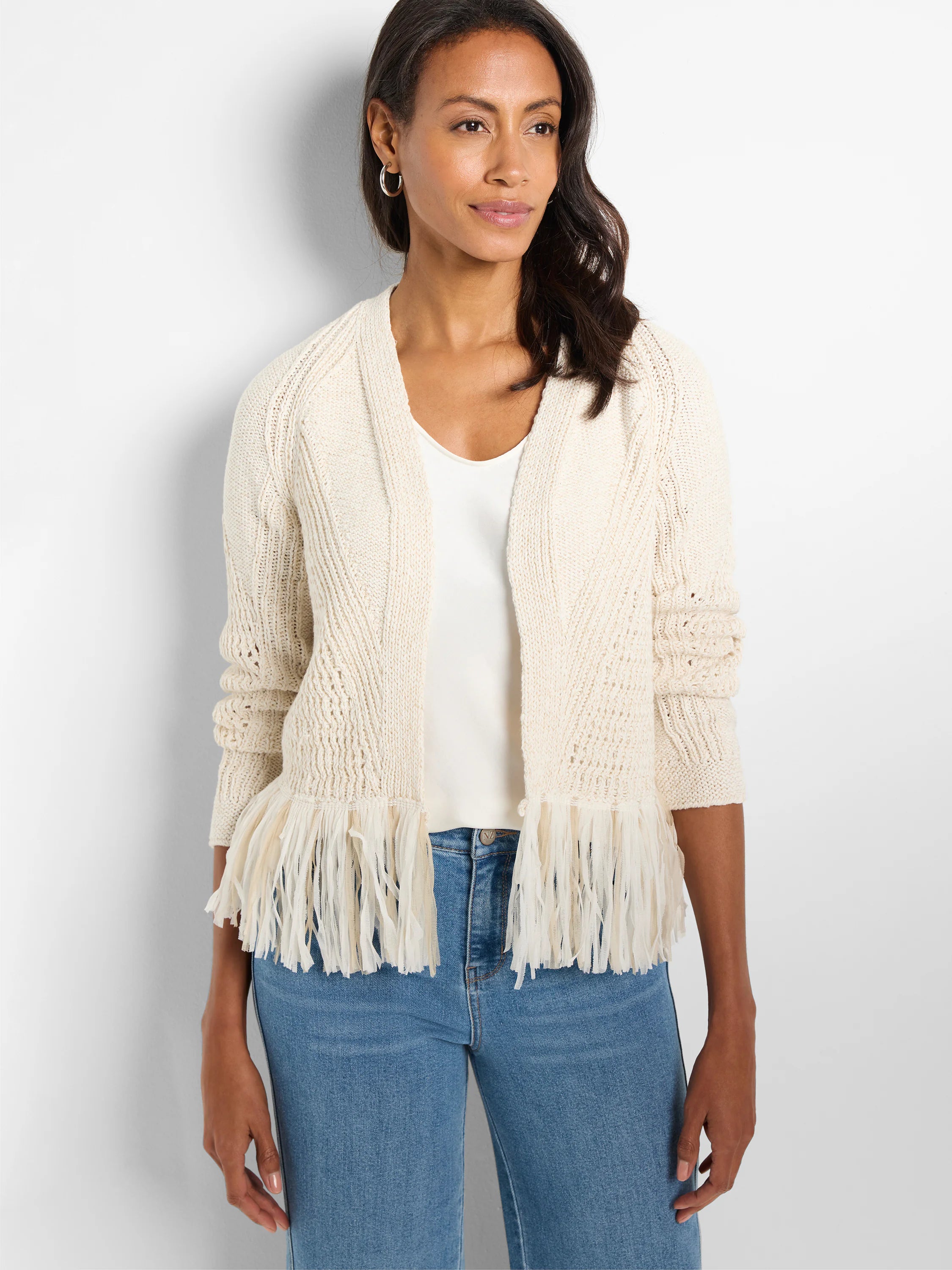 Off-white open knit cardigan with varied textures and a multi-strand cream fringe hem.