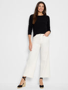 Black Baby Garter knit crew neck sweater with long sleeves and ribbed cuffs.